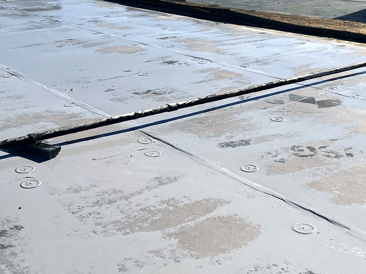 Before: close-up of an aged roof seam