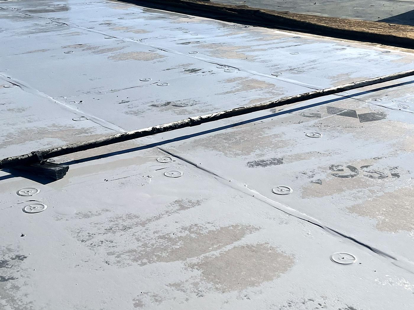 Before: close-up of an aged roof seam